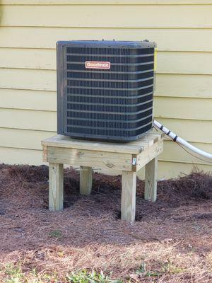 GOODMAN A/C unit.
Salt treated deck build to fit the unit to keep it off the ground and away from animals.