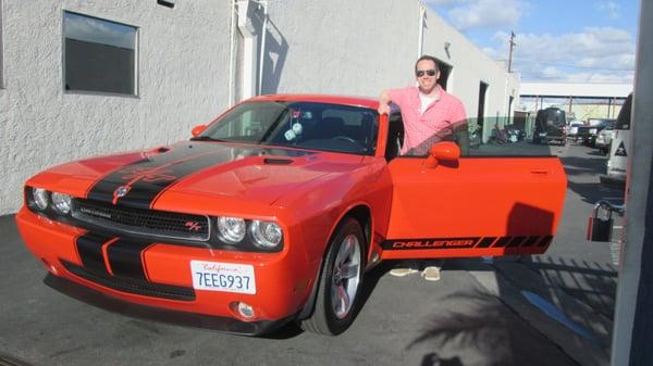 Happy customer taking home his 2009 Dodge Challenger RT