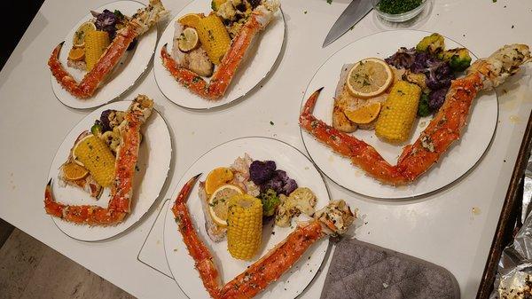 Alaskan King Crab Legs with a garlic butter sauce with fresh caught Wahoo, roasted tri color cauliflower and sweet corn on the Cobb