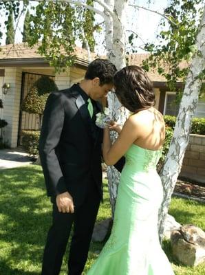 Megan pinning Adam's boutonniere