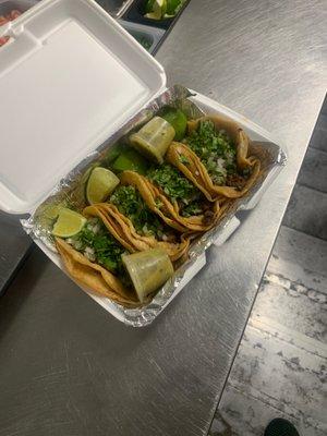 Regular steak tacos with onions and cilantro