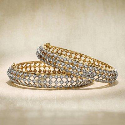 Beautiful handcrafted gold and diamond bangles set in 18 karat gold.