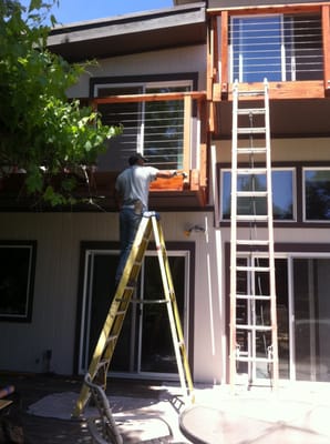 New balcony decks and combo redwood/cable railings.