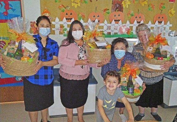 Milo's teachers with some "thank you" baskets with Milo at the bottom-right.  :)