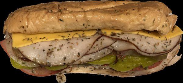 Were we keep it wet! Turkey Hoagy with american cheese tomatoes pickles onions peppers seasonings and oils.