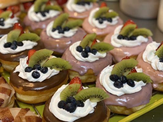 Fruit donut with white cream on top