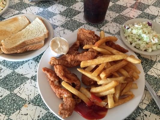 Fried catfish served with fries and coleslaw