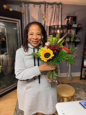 Here's me with my first ever floral arrangement thanks to Sophia Billoti's patience and coaching.