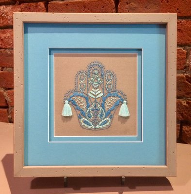 Here's an example of a small needlework piece - stretched, double-matted and protected with TruVue Museum glass!