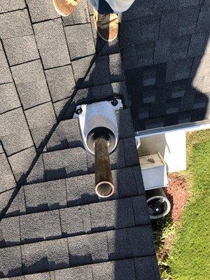 Roof work of all types . Installed new boot for bathroom vent here.