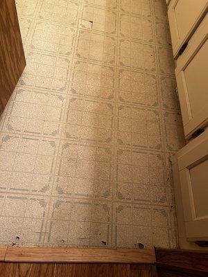 Bathroom flooring was worn and had soft spots. Floor smells rotten.