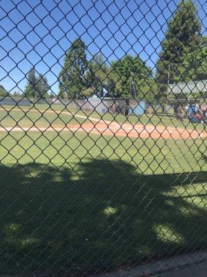 View of home plate from the guest side of the Major field