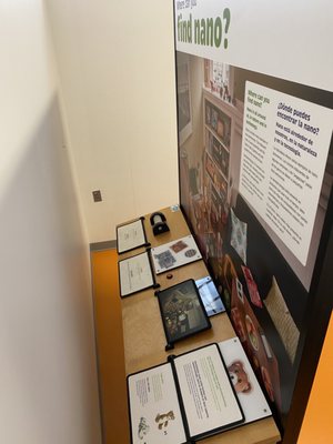 ferrofluid room, a poster board section facing the wall. "where do you find nano?"