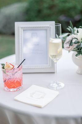 Our signature cocktails. Napkins and sign by Charmed Events.