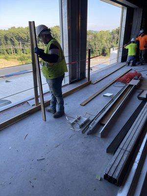 Amazon building exterior panel install and window framing