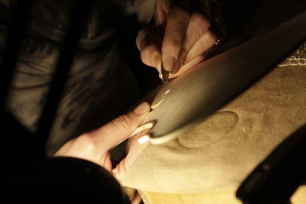 Shaving the front of a violin