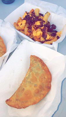 Puerto Rican empanada with a side of loaded fries... my personal favorite