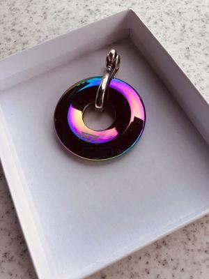 The hematite pendant changes color depending on how the light hits it