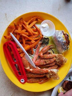 Snow crab legs with sweet potato fries and based potato