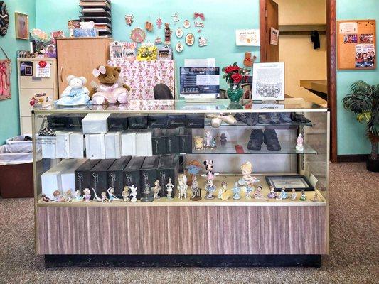 Display case filled with ballet shoes for sale.