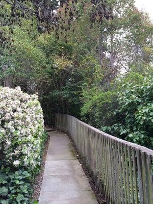 Walkway along creek at Cowbarn Apartments.