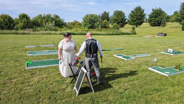 Mini golf at wedding reception of Brooke and Christopher. Harmony Springs Center in Green. www.adivinetimedj.com