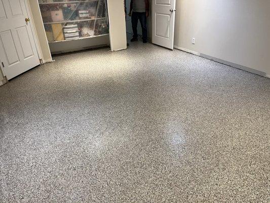 Basement floor that had previously been carpet. Replaced carpet with a coating due to issues with flooding through the foundation.