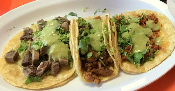 Lengua, Al Pastor, Choriza tacos with cilantro and creamy avacado sauce