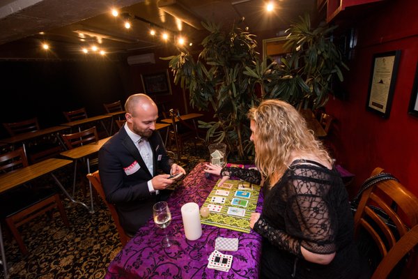 Private one-on-one reading at a party.