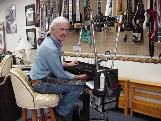 Jim working on a pedal steel guitar.