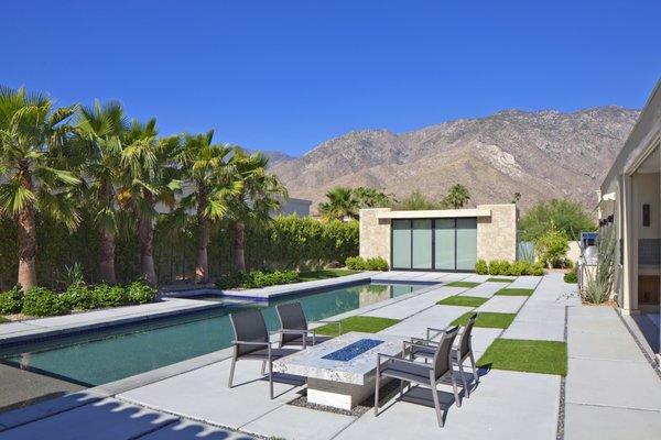 A Palm Springs remodel including updated softscape/hardscape, installed fire feature and putting green.