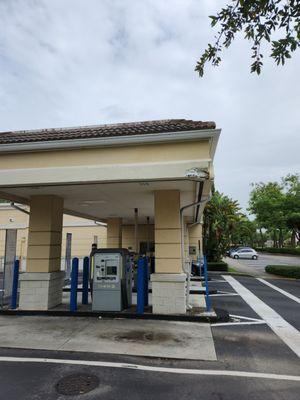 Overhead bank corner at drive-thru lanes has serious structural Damage at corner.