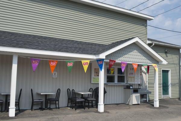 A view of the walk-up window and outdoor seating where customers gather to enjoy each others' company. There is no town quite like Clymer!