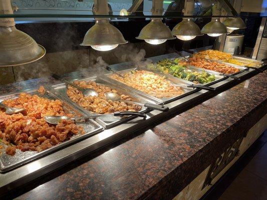 Orange pork, sauteed mushroom, seafood and vegetables, chicken broccoli, orange chicken, fried rice and low mein.