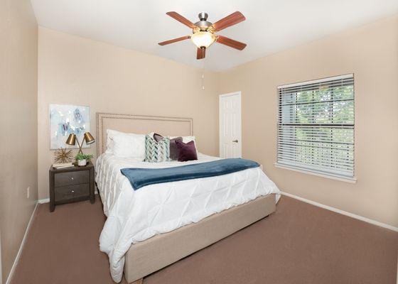 Bedroom with ceiling fan at Briargrove at Vail