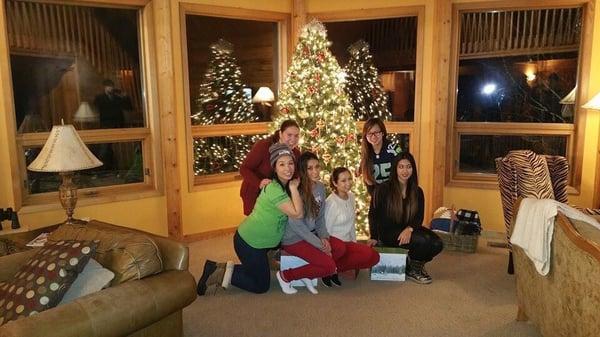 The girls posting in front of the decorated Christmas tree that the owner did for us.