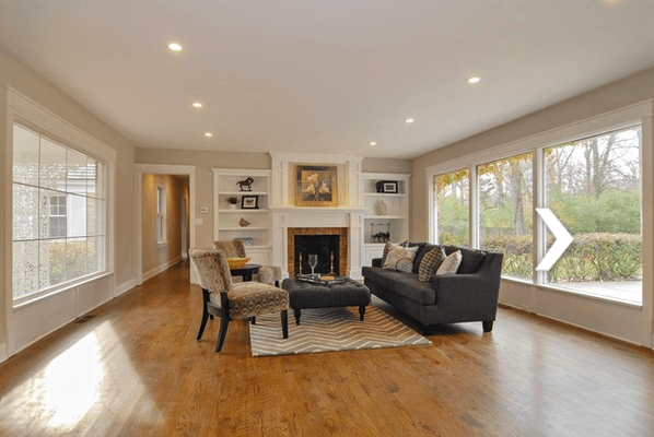 New living room in Lake Forest, IL.  Includes installing new floors and fireplace mantel along with new lighting and painting.