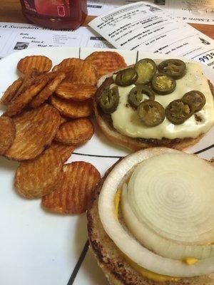 Brat burger w/ onion, yellow mustard, jalapeño and pepper jack cheese and Cajun chips.