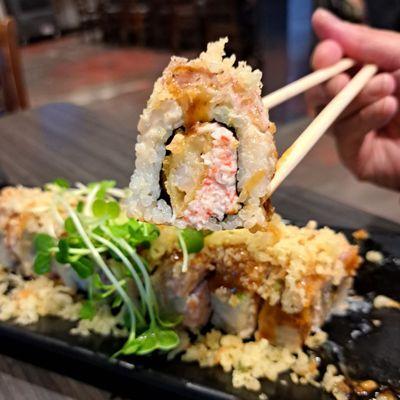 June 2023 Roll of the Month: Dracula Roll = California roll with tempura flakes & shrimp. Can't taste avocado or salmon. Grassy microgreens.