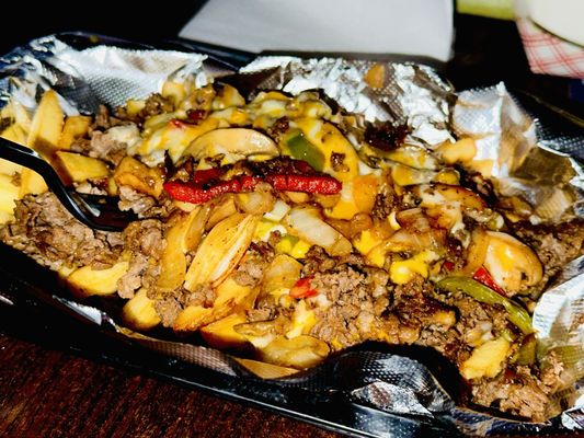 Steak and cheese over fries, minus the bread