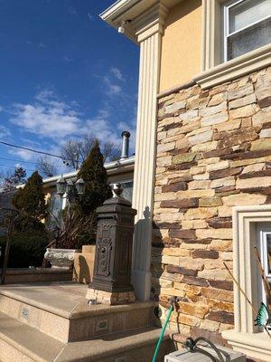 Corner stucco,stones,steps,landscaping,camera's and mailbox!!!!