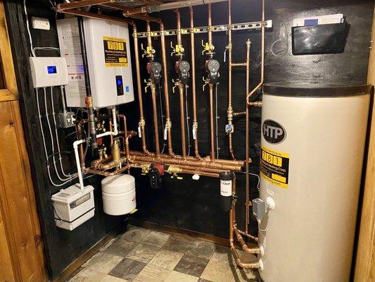 Milton Massachusetts 2020
 So much heart and soul put in this installation...
 Navien NCB150 boiler with 80 Gallon superstor.