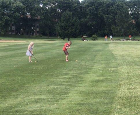 Kids playing golf