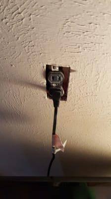 Electrical receptacle that is not properly secured.