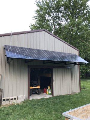 Solar awning, if you're going to need to build an awning for shade, why not put those rays of sun to work rather than just blocking them?