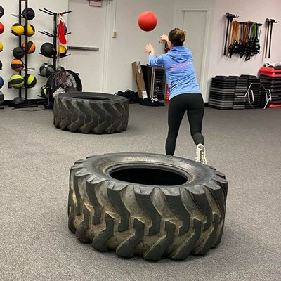 Throwing a weighted ball in a tire is always fun for strength training and burning calories.