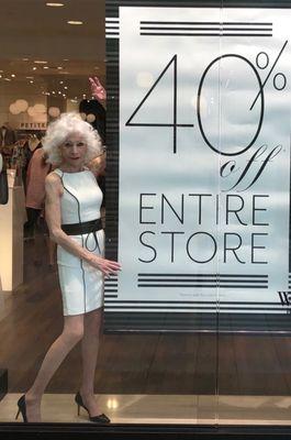 Modeling a Summer dress in he window of the store!