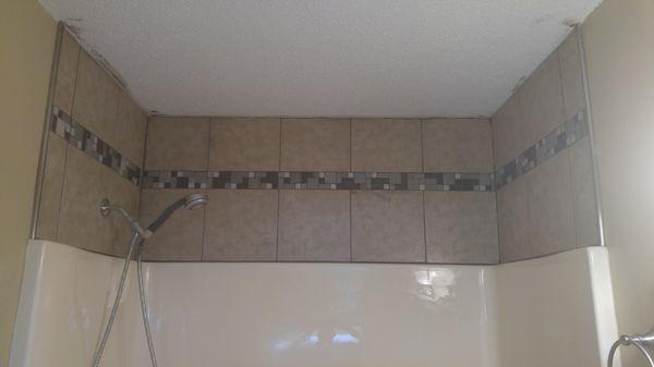 Moldy drywall removed and tile installed