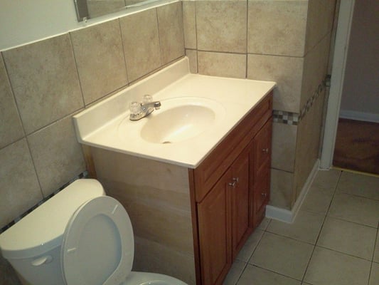 Sink, toilet, flooring and tile installation