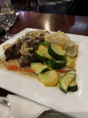 Steak tips with mashed and vegetables.  Each bite of this very rich, succulent meal made you want more.